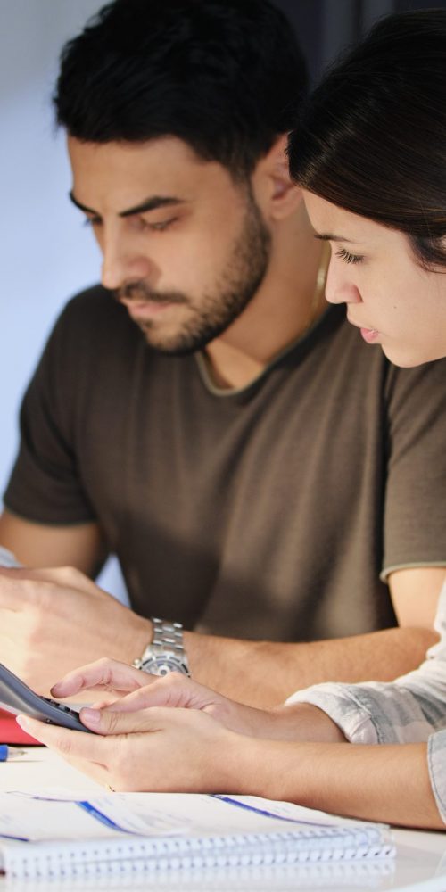 Man and woman worried about debts and thinking about a debt management plan