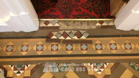 Victorian Minton tiles reset during Walsall hallway restoration